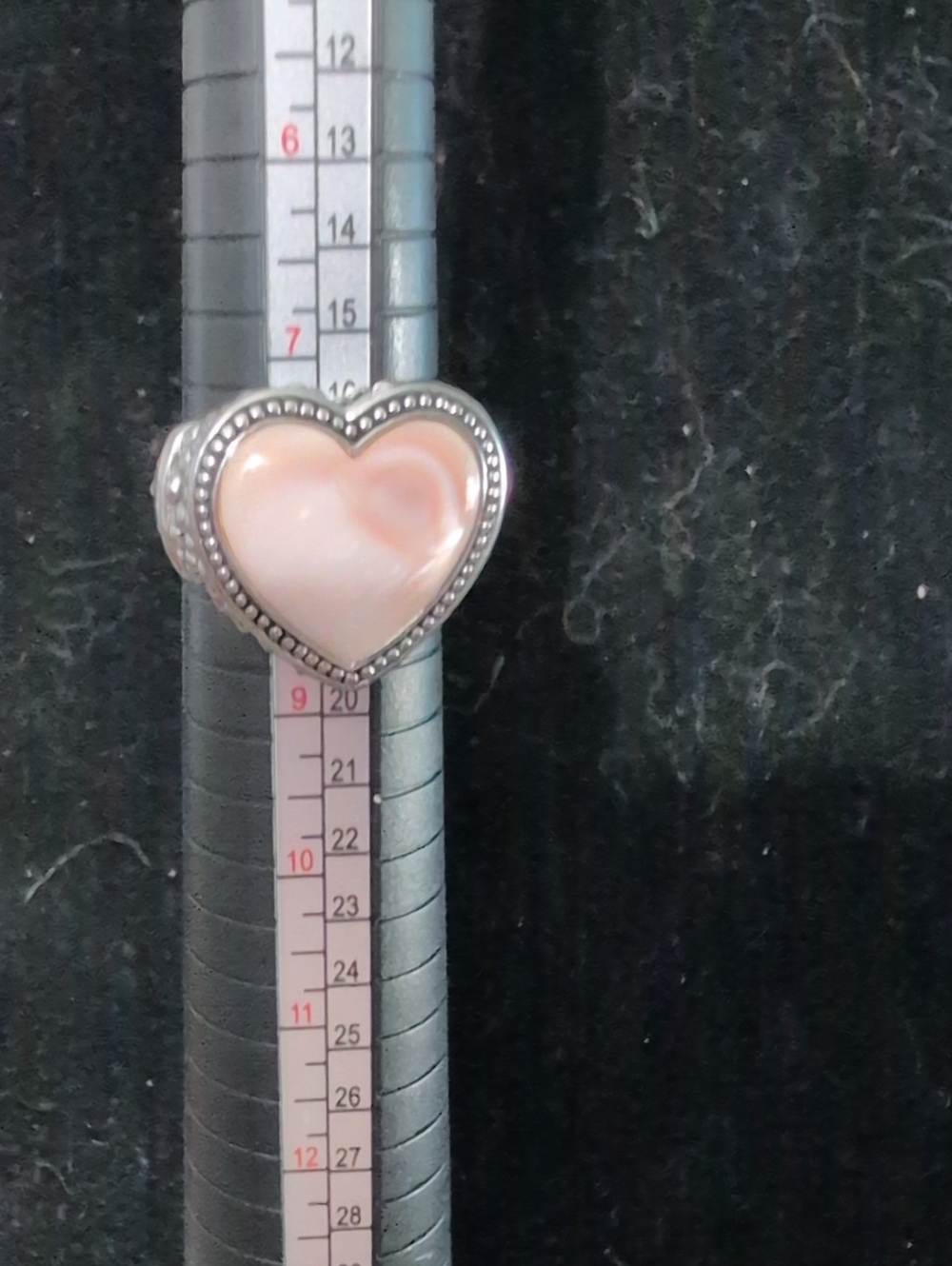 heart-shaped mother-of-pearl cabochon with a dotted beaded border
